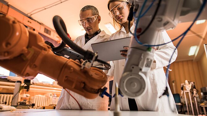 Researchers work on a machine