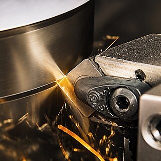 A ceramic cutting insert in use during turning