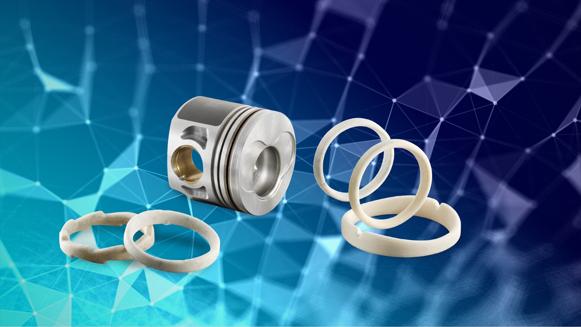 Ein silbernes Metallstück und mehrere weiße Salzkerne der Emil Müller GmbH vor blauem Hintergrund