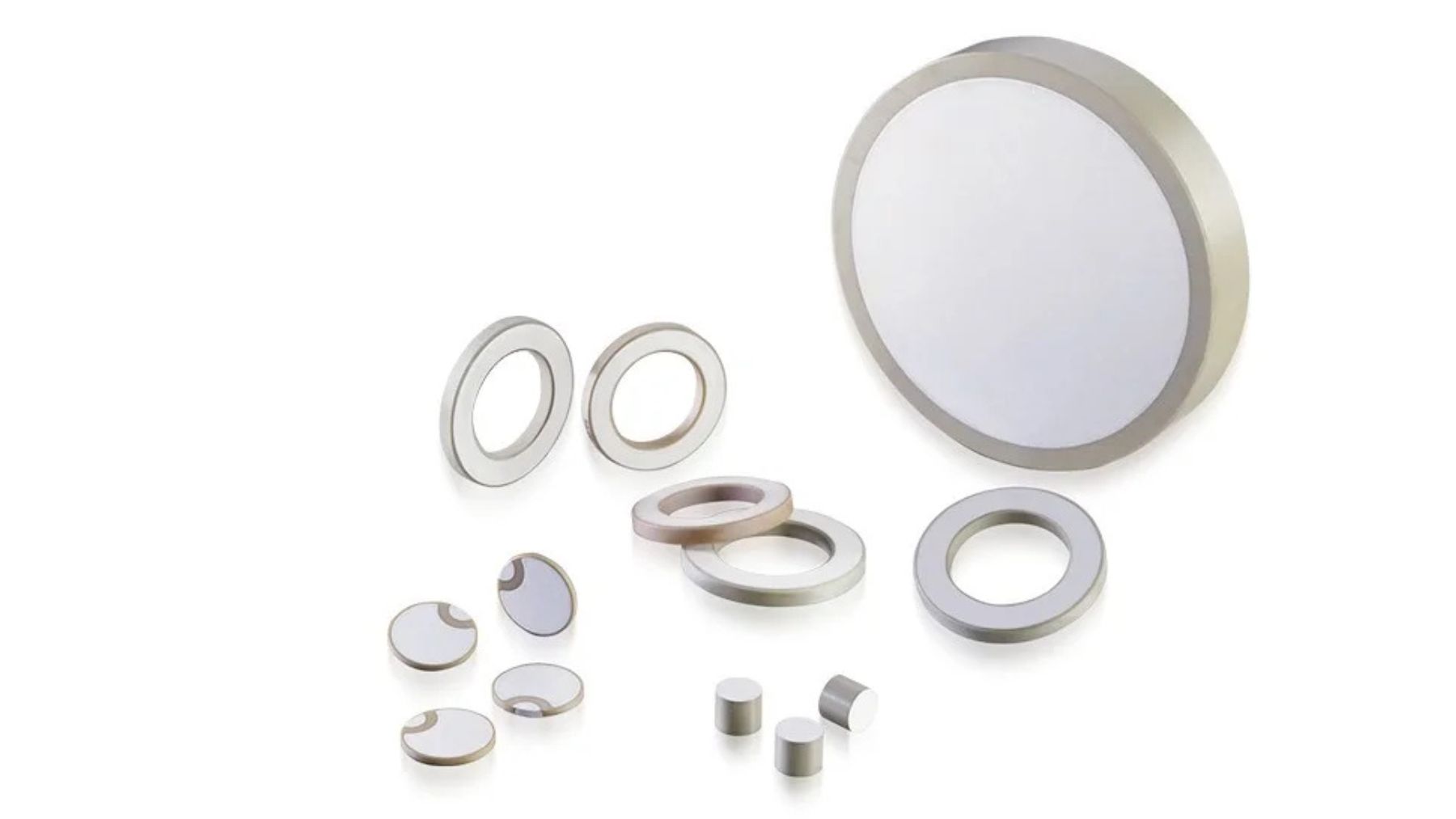 Piezoceramic rings and disks on a white background